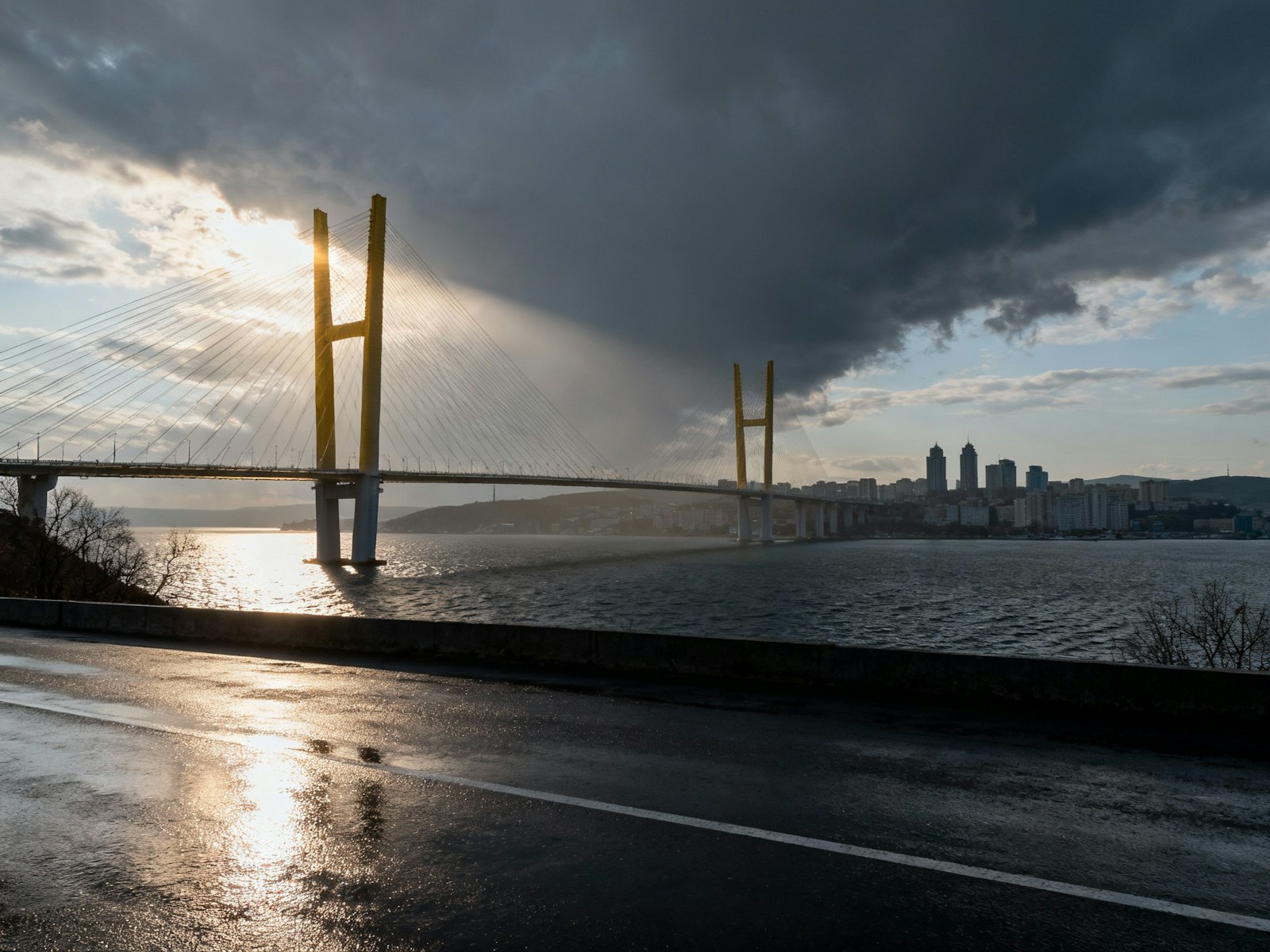 A suspension bridge under a storm cloud