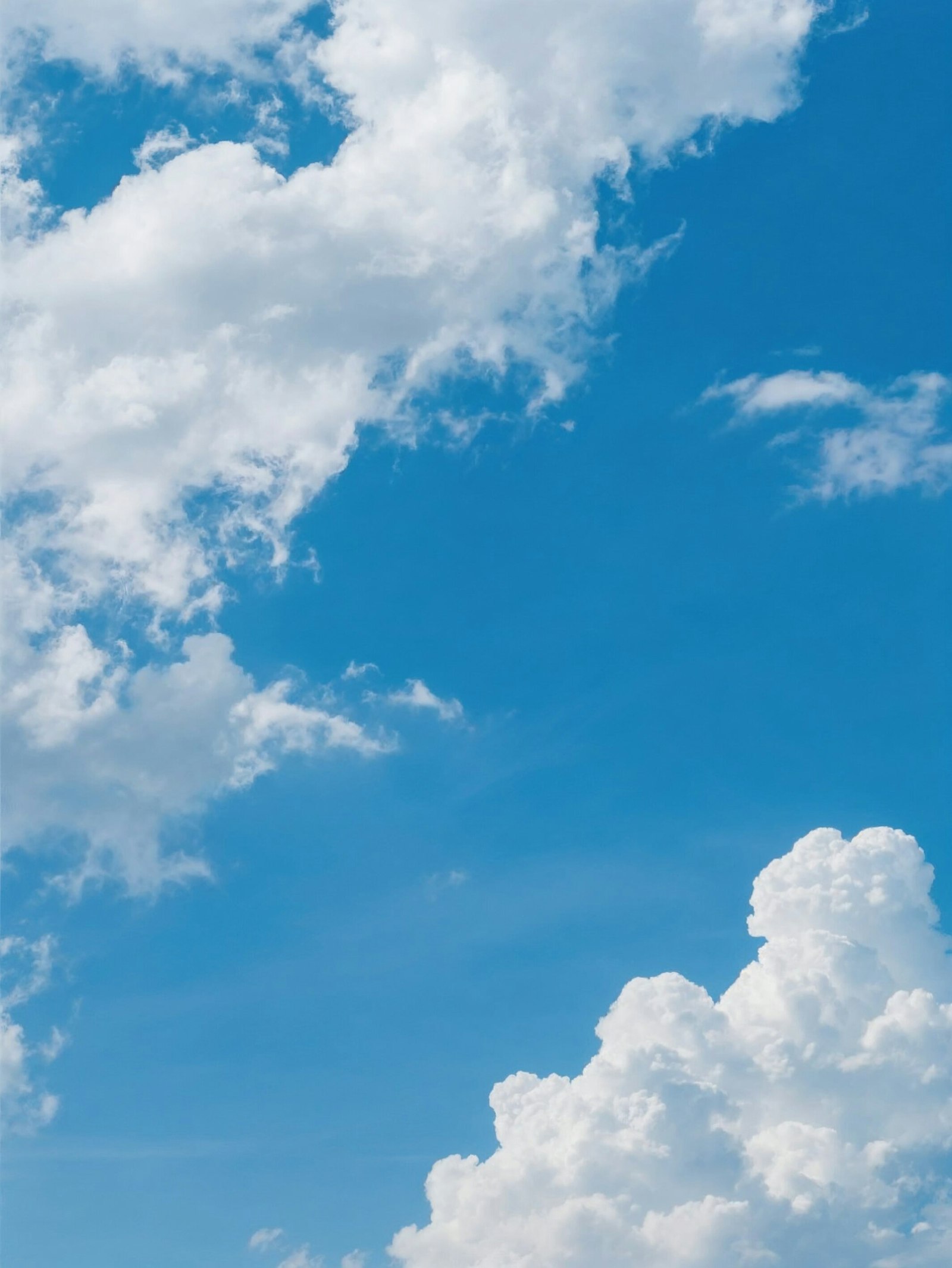 White clouds in a bright blue sky